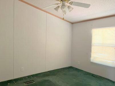 181 Wild Oak Road Southeast Cleveland, TN 37323 - Photo 8 of 12 an empty room with a window and a fan