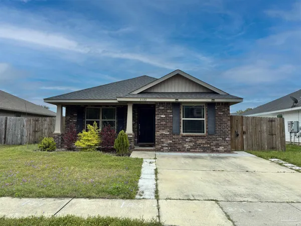 a front view of a house with a yard and porch
