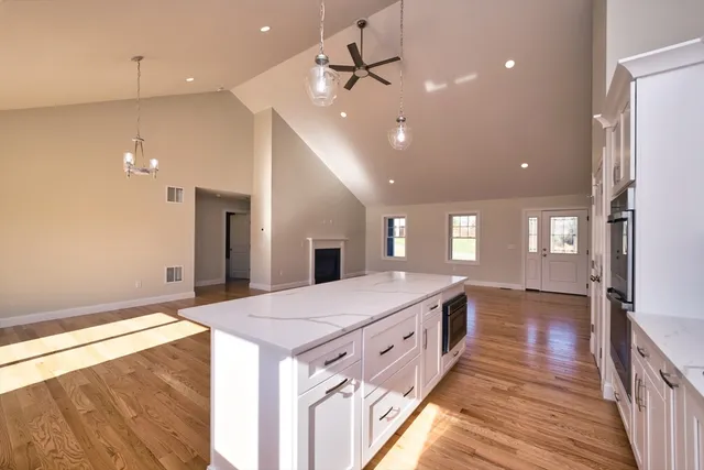 a spacious bathroom with a sink and a mirror