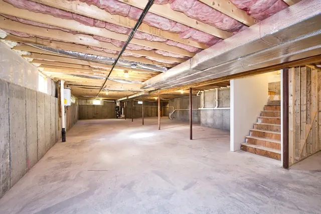 a view of empty room with wooden walls