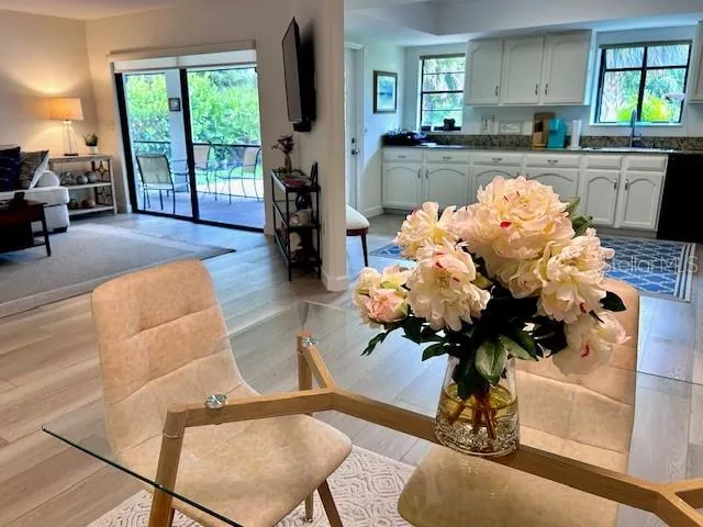 a living room with furniture fireplace and chandelier