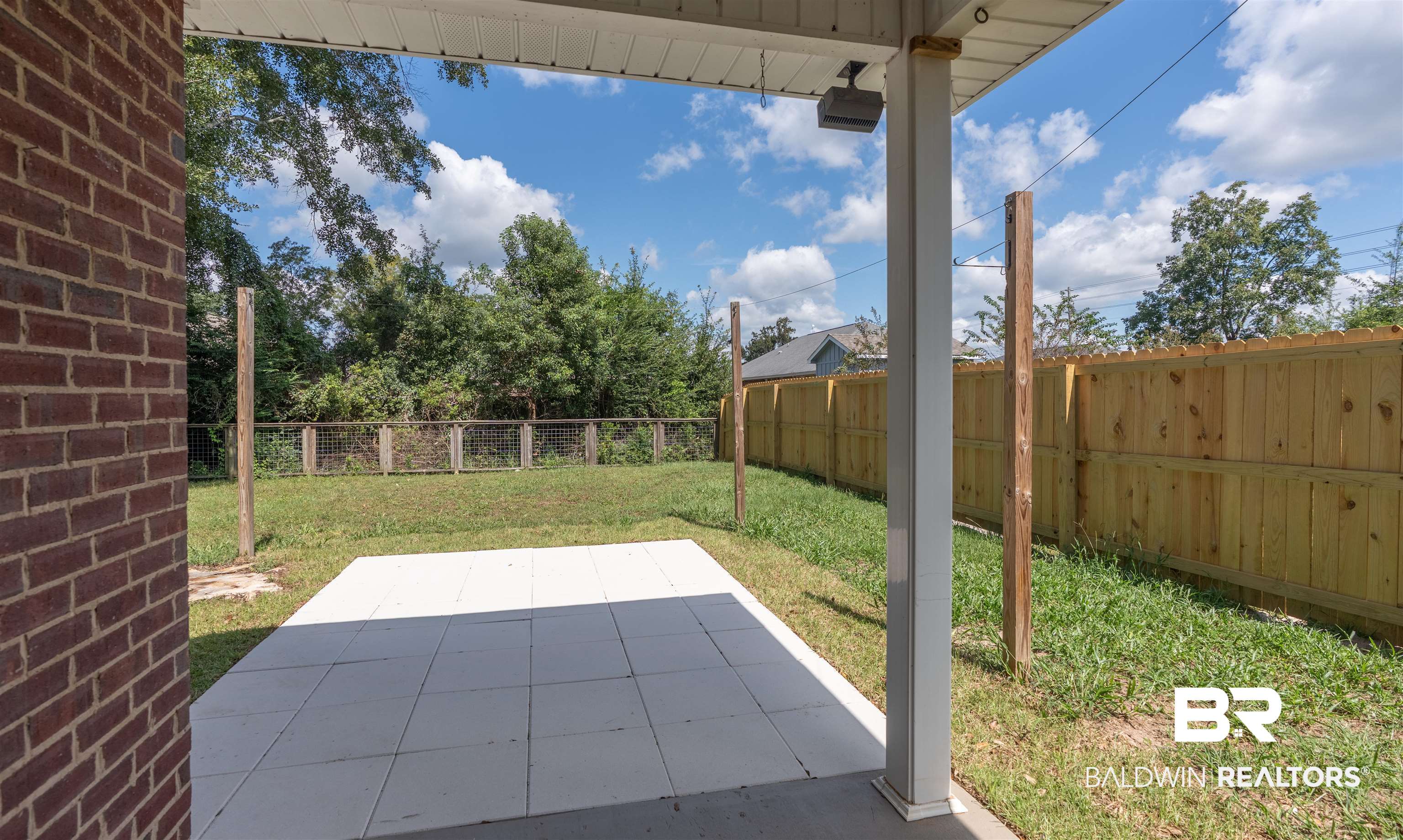 14947 Silveroaks Loop Silverhill, AL 36576 - Photo 13 of 24 Fenced backyard with a patio area