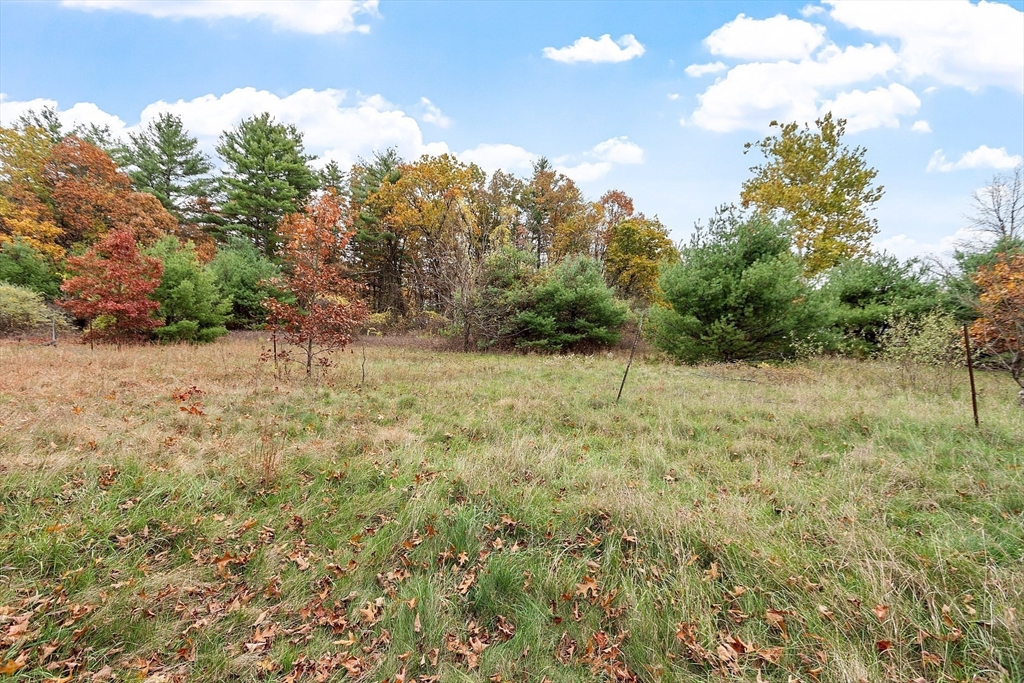 45 Clark Road Shirley, MA 01464 - Photo 11 of 33 a view of a field with trees in the background