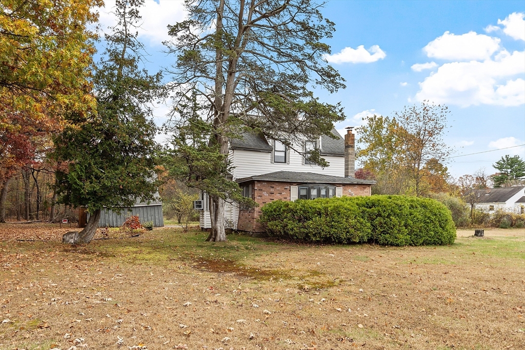 45 Clark Road Shirley, MA 01464 - Photo 3 of 33 a view of a building with a yard