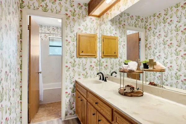 a bathroom with a sink and a mirror