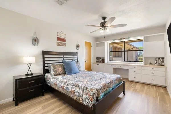 a bedroom with a bed and window