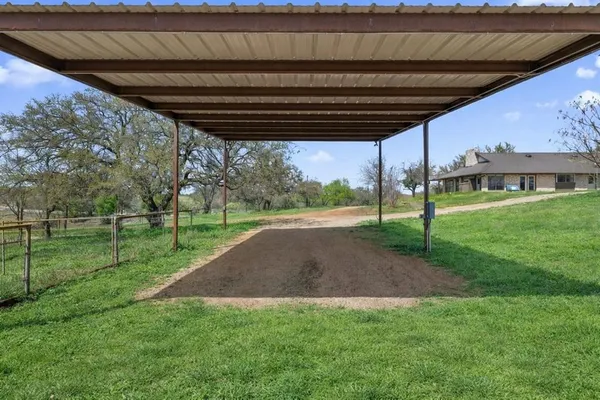 a view of a backyard with tree