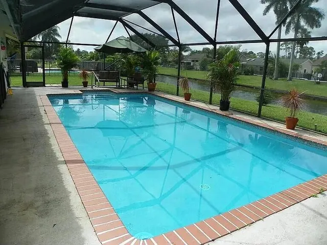 a view of a swimming pool with a patio