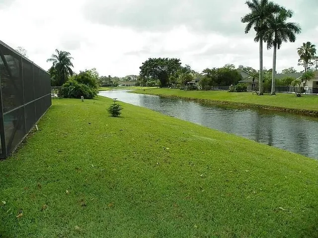 a view of a lake with a big yard
