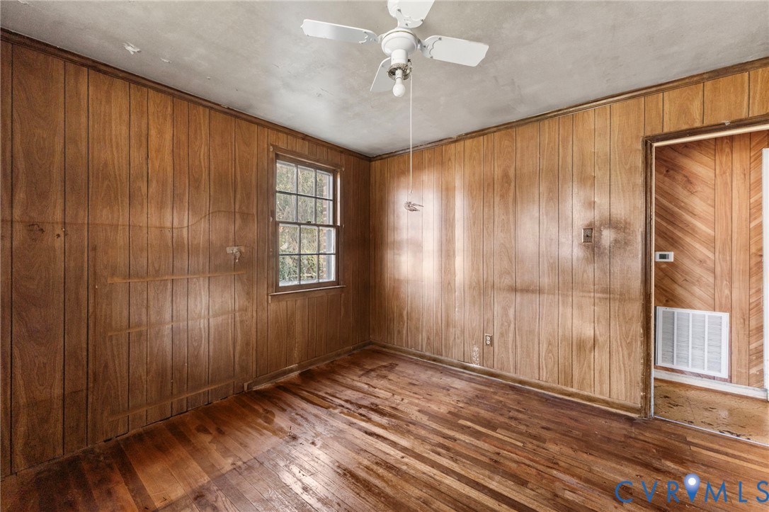 2925 West Strathmore Road Richmond, VA 23237 - Photo 13 of 25 wooden floor in an empty room with a window
