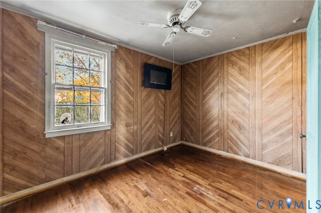 2925 West Strathmore Road Richmond, VA 23237 - Photo 15 of 25 a view of empty room with wooden floor and fan