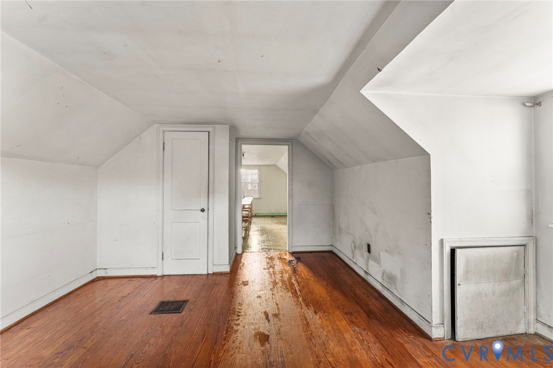 2925 West Strathmore Road Richmond, VA 23237 - Photo 20 of 25 a view of a room with wooden floor and white walls