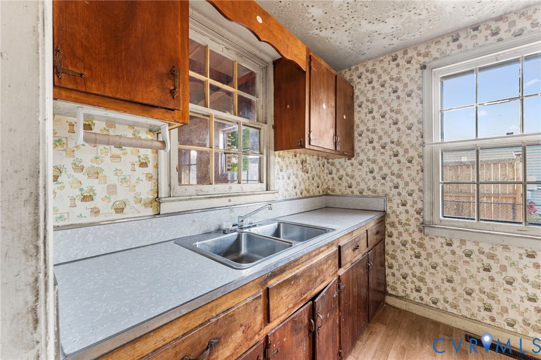 2925 West Strathmore Road Richmond, VA 23237 - Photo 6 of 25 a kitchen with stainless steel appliances granite countertop a sink and a window