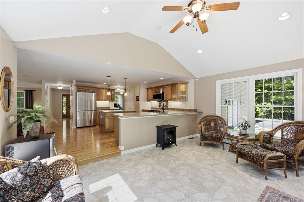 345 Bragg Road Warren, MA 01585 - Photo 17 of 41 a living room with furniture a window and a view of kitchen