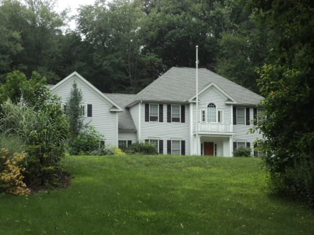 12 Spector Road Woodbridge, CT 06525 - Photo 1 of 1 a front view of a house with a yard