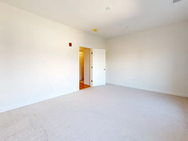 a bathroom with a granite countertop sink a toilet and a shower