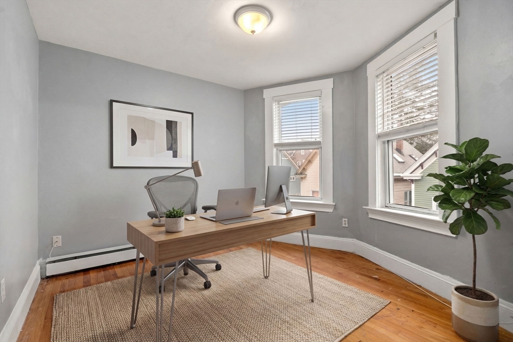 8 Haverford Street Boston, MA 02130 - Photo 14 of 34 a workspace with furniture and a potted plant