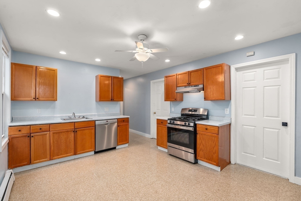 8 Haverford Street Boston, MA 02130 - Photo 15 of 34 a kitchen with stainless steel appliances granite countertop stove top oven a sink and dishwasher