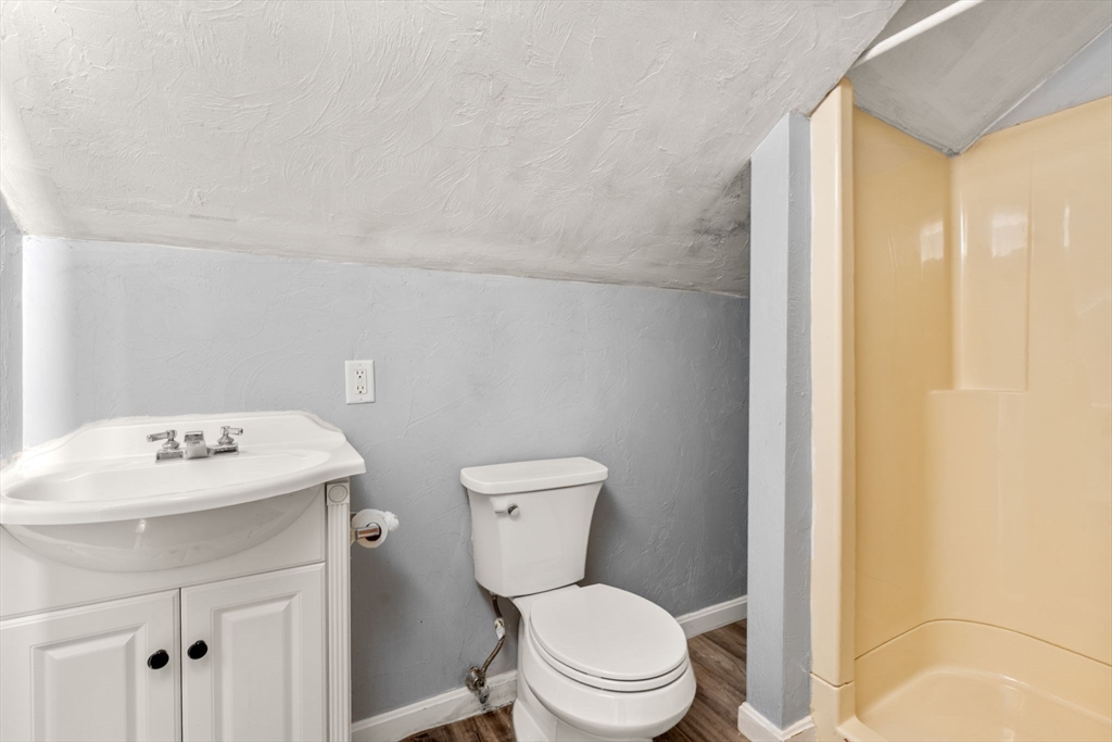 8 Haverford Street Boston, MA 02130 - Photo 23 of 34 a white toilet sitting next to a bathroom sink