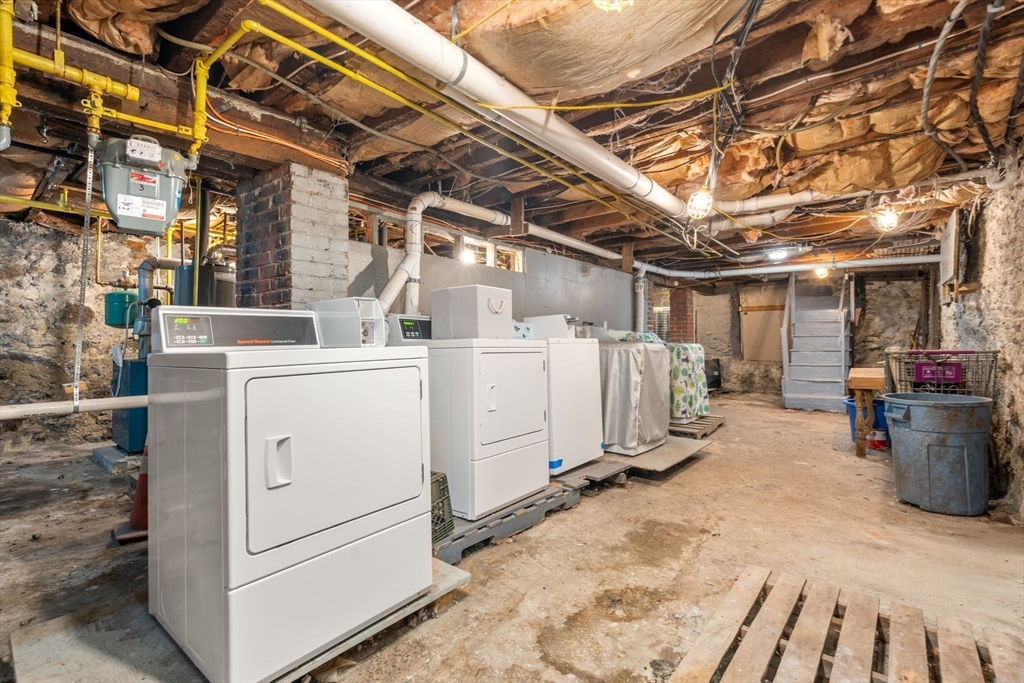 8 Haverford Street Boston, MA 02130 - Photo 29 of 34 a view of a storage room with washer and dryer