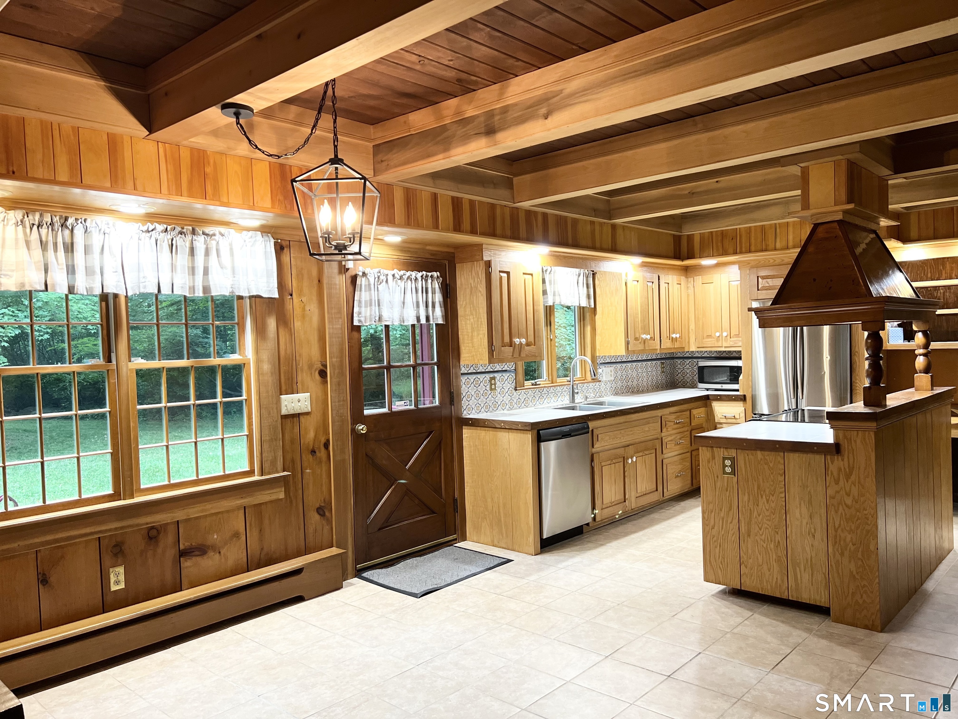 38 Clark Hill Road East Haddam, CT 06423 - Photo 6 of 35 a kitchen with a sink and wooden cabinets