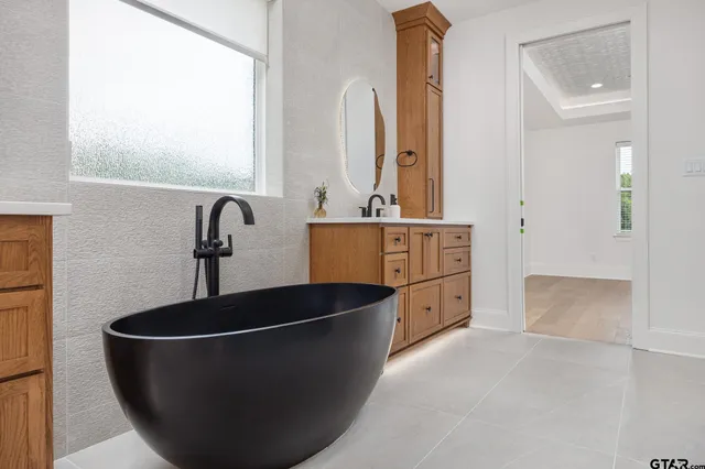 a kitchen with stainless steel appliances granite countertop a sink and a stove