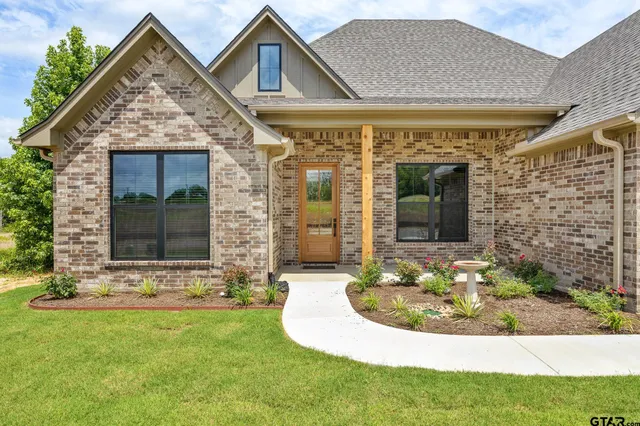 a view of a house with outdoor seating area