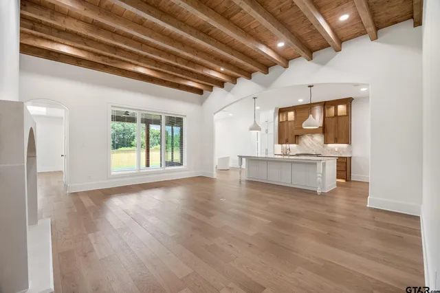 a view of a kitchen with a sink cabinets and a wooden floor
