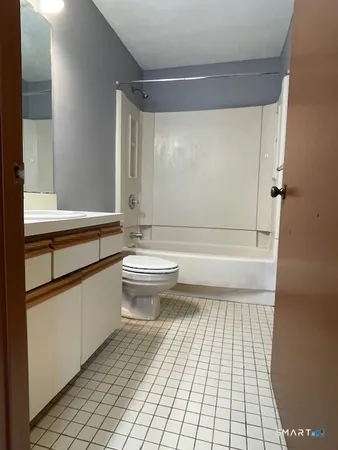 a bathroom with a sink vanity and mirror