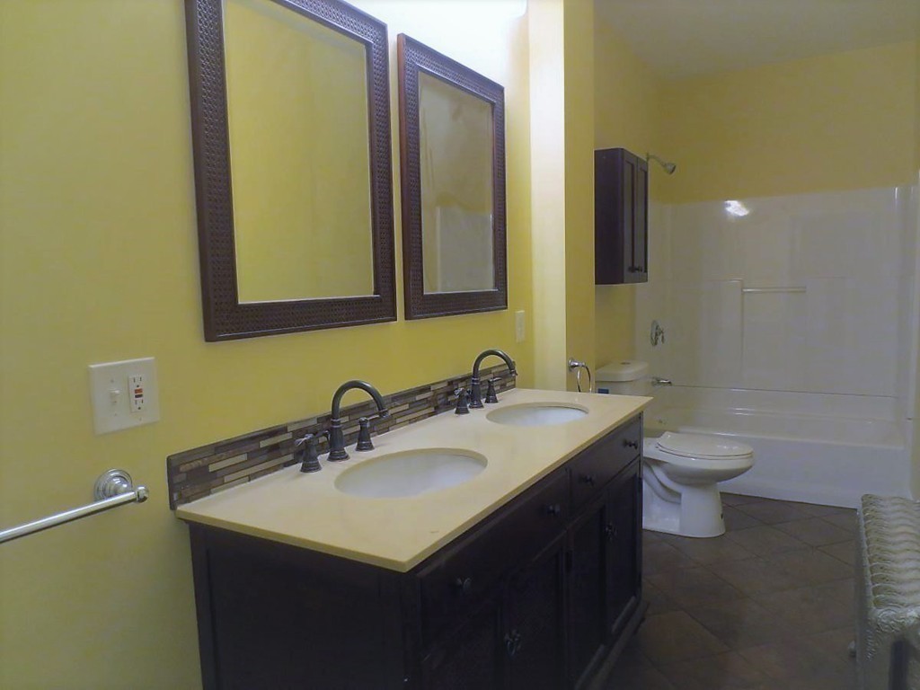 298 Whipple Street Fall River, MA 02721 - Photo 12 of 21 a bathroom with a sink and a mirror