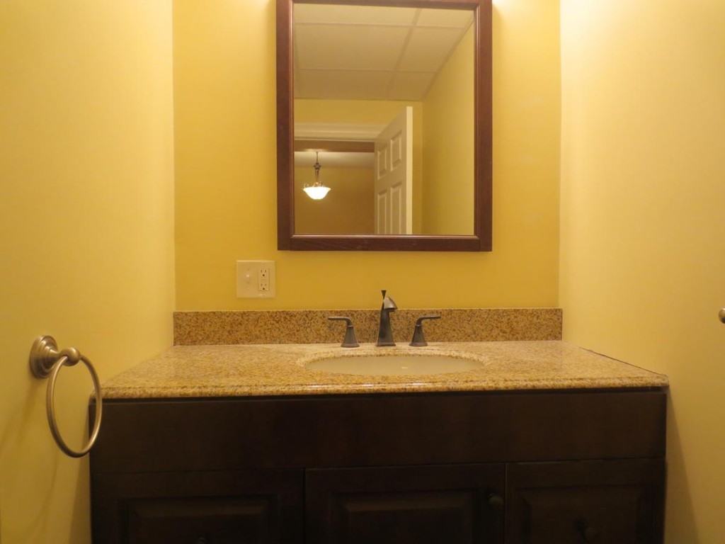 298 Whipple Street Fall River, MA 02721 - Photo 18 of 21 a bathroom with a granite countertop sink and a mirror