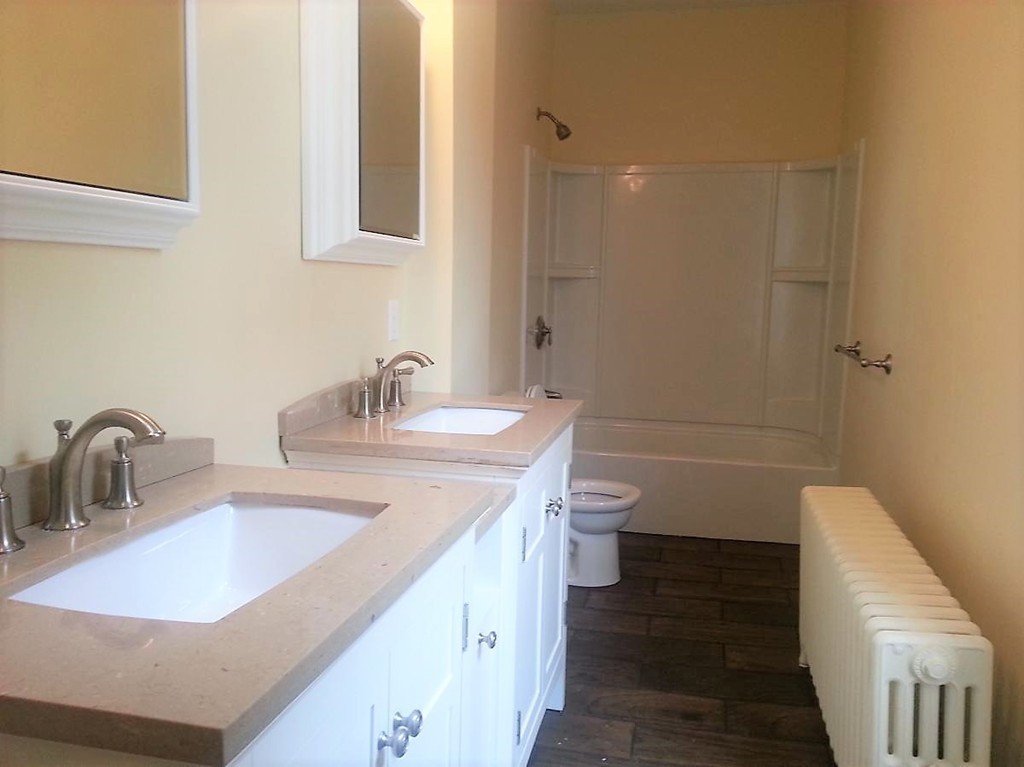 298 Whipple Street Fall River, MA 02721 - Photo 5 of 21 a bathroom with a sink and a mirror