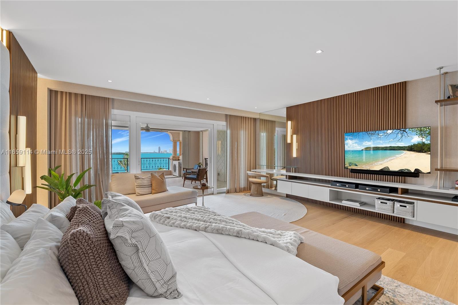 5242 Fisher Island Drive, Unit 5242 Miami Beach, FL 33109 - Photo 1 of 69 a living room with furniture and a flat screen tv