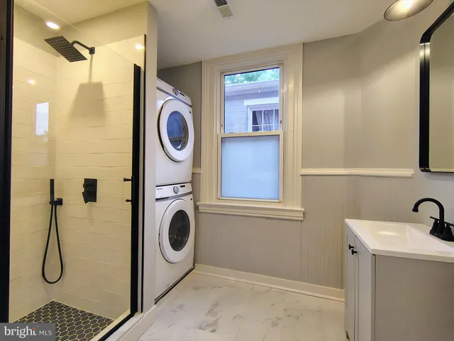 a bathroom with a toilet and a window