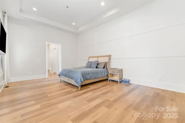 a bedroom with a bed and a table