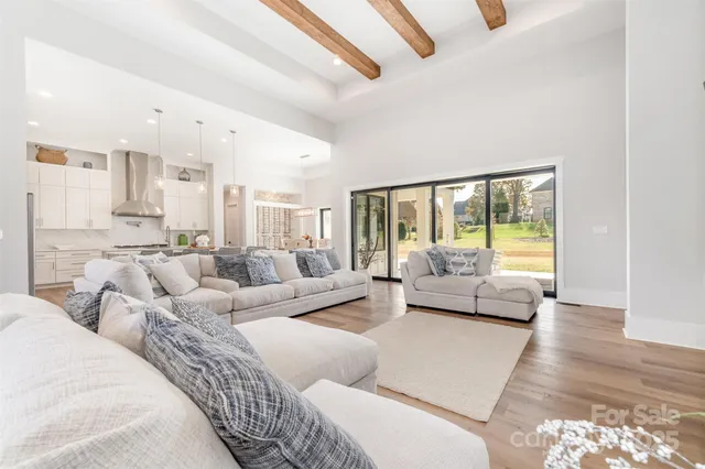 a large bedroom with furniture and large windows