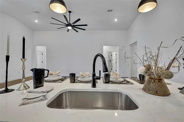 a dining room with furniture a chandelier and window