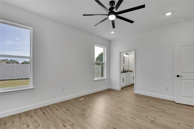 a bathroom with double vanity sinks and a mirror