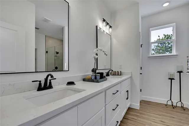 a bathroom with a granite countertop toilet