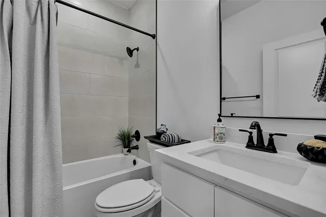 a room with wooden floor and shoes