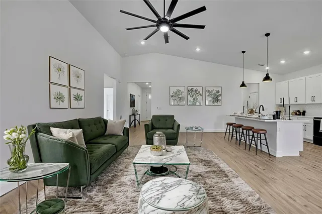 a view of empty room with wooden floor and window