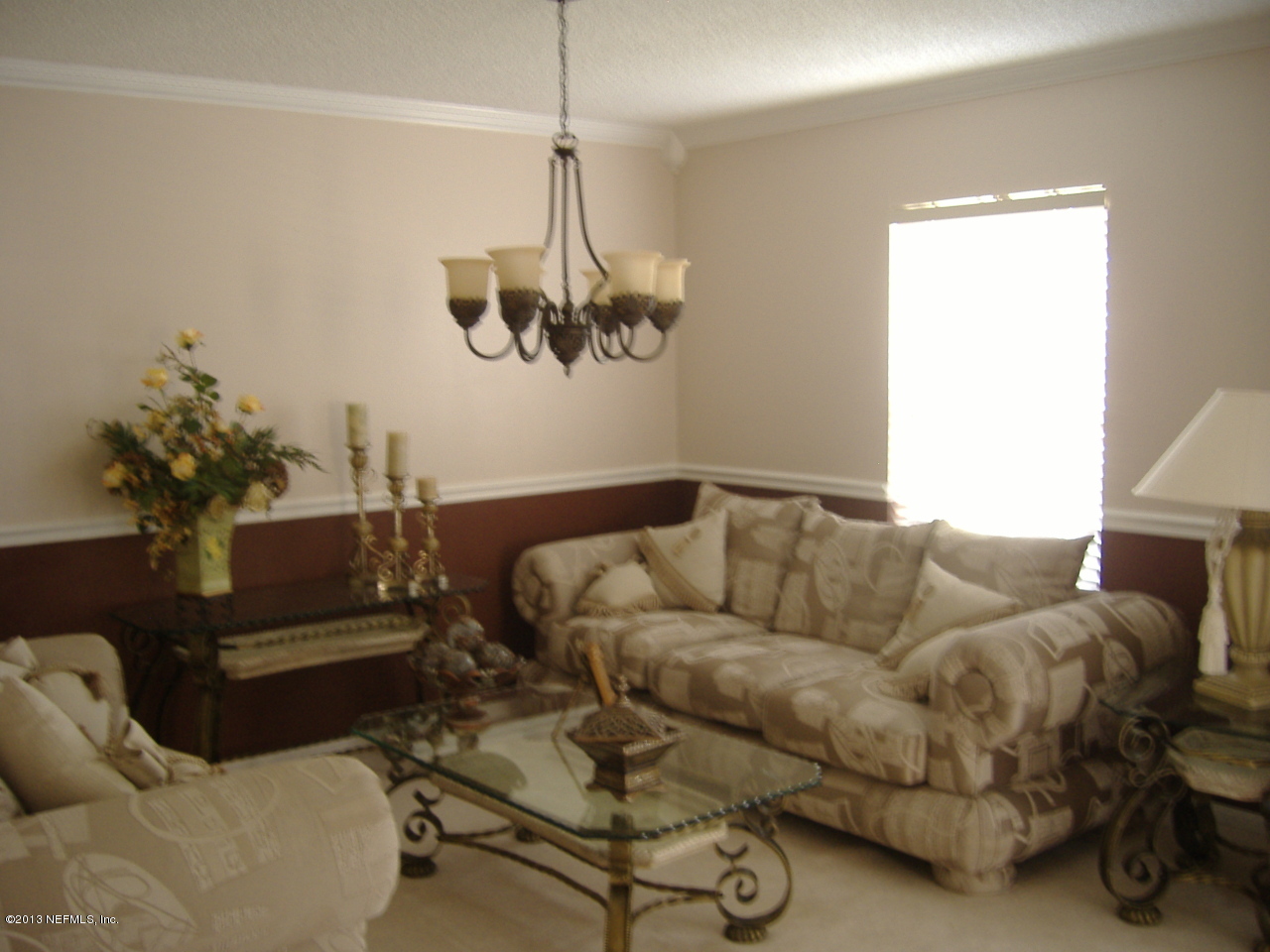 12276 Hickory Forest Road Jacksonville, FL 32226 - Photo 11 of 15 a living room with furniture and a chandelier