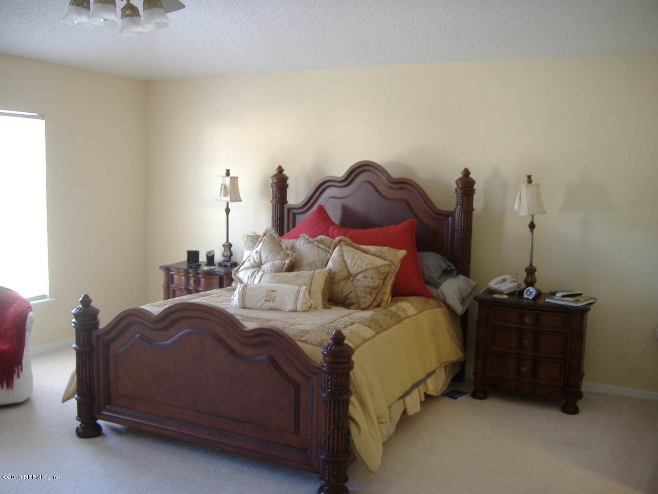 12276 Hickory Forest Road Jacksonville, FL 32226 - Photo 2 of 15 a bedroom with a bed and a lamp on dresser