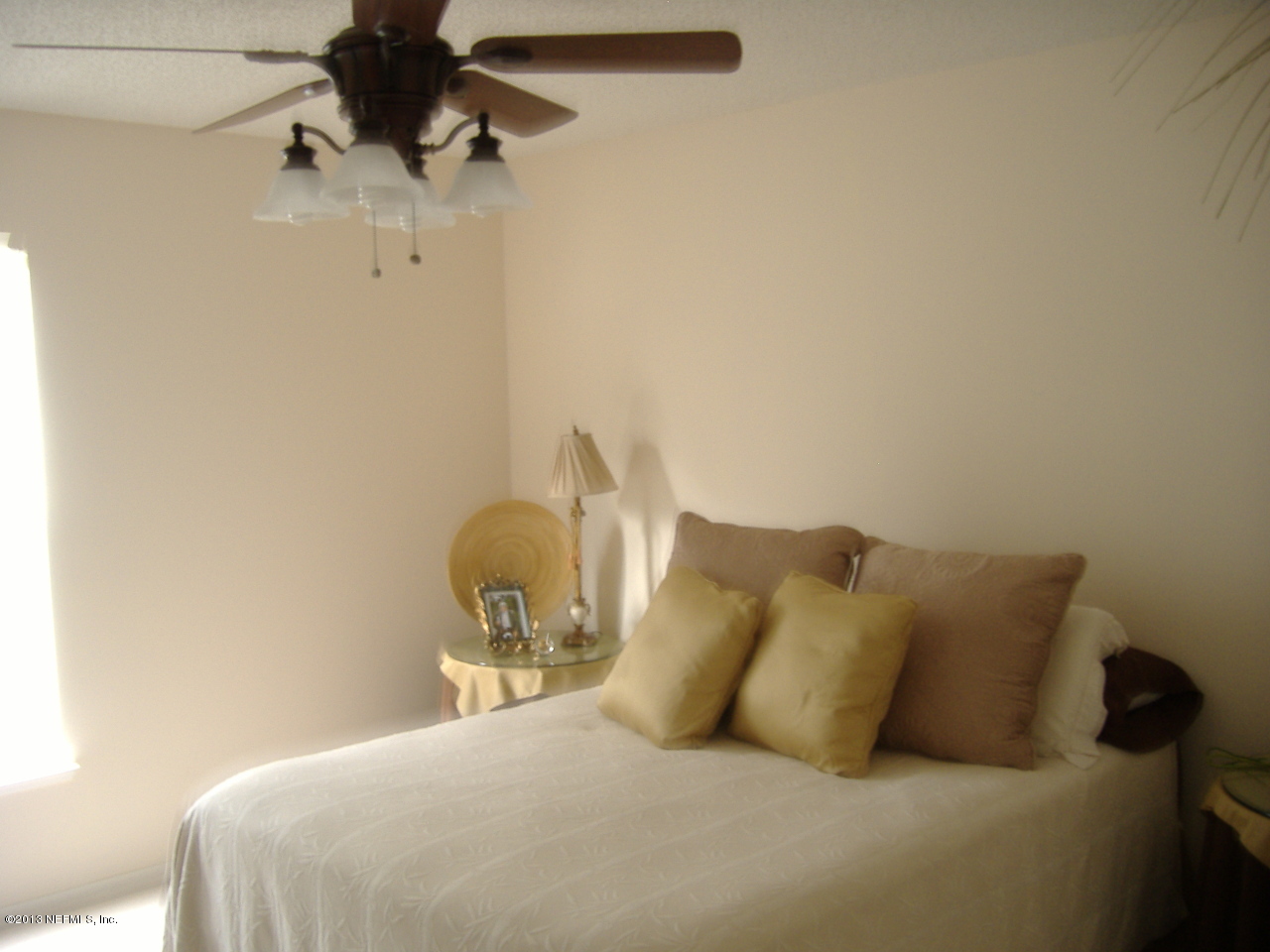 12276 Hickory Forest Road Jacksonville, FL 32226 - Photo 6 of 15 a bedroom with a bed and a chair