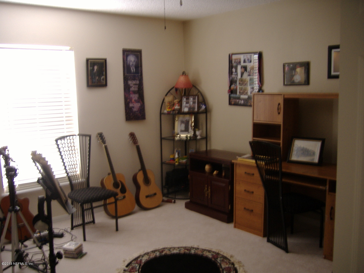 12276 Hickory Forest Road Jacksonville, FL 32226 - Photo 8 of 15 a view of a workspace with furniture and cabinet