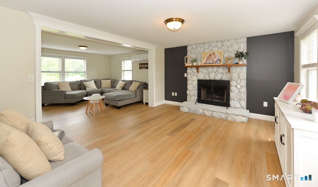 109 Harrison Lane Bethlehem, CT 06751 - Photo 4 of 28 a living room with furniture and a fireplace