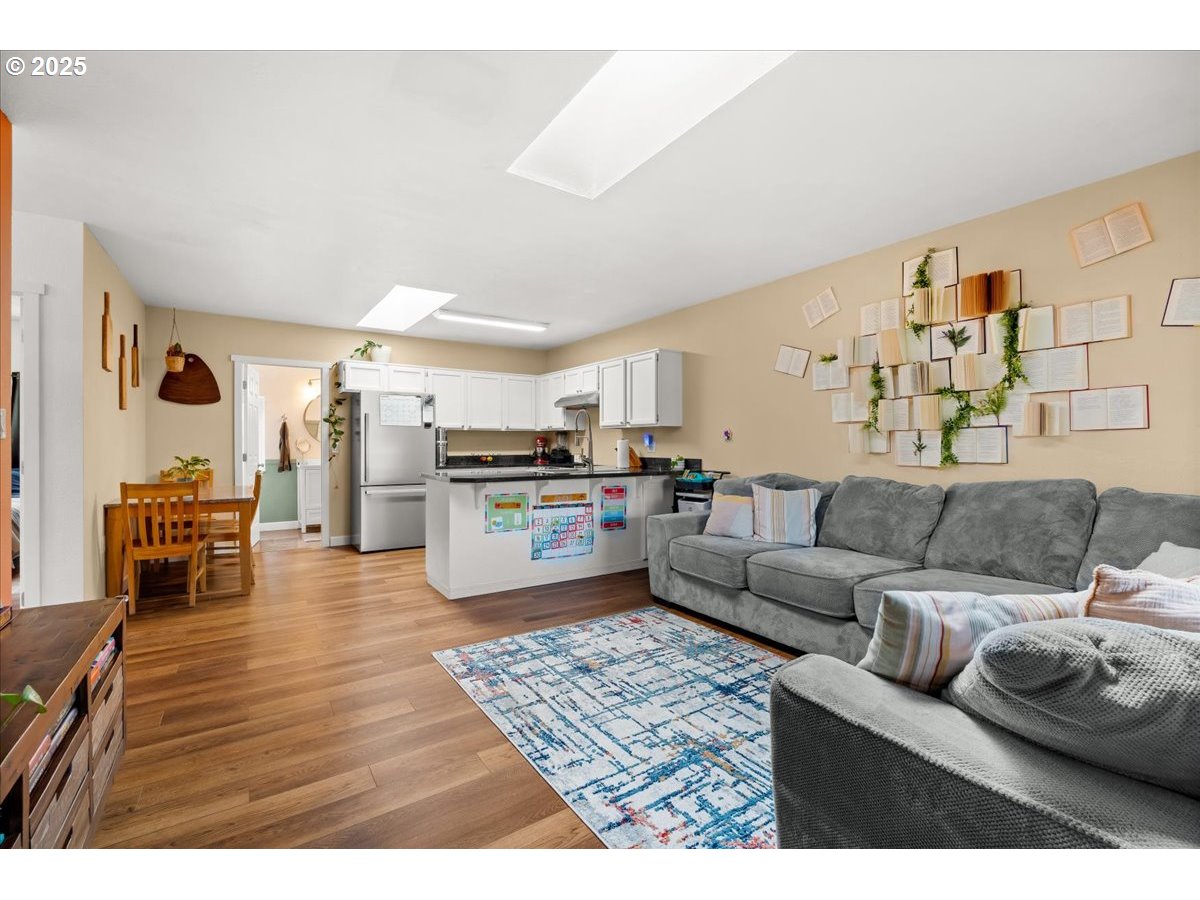 1720 B Street Forest Grove, OR 97116 - Photo 11 of 38 a living room with furniture and kitchen view