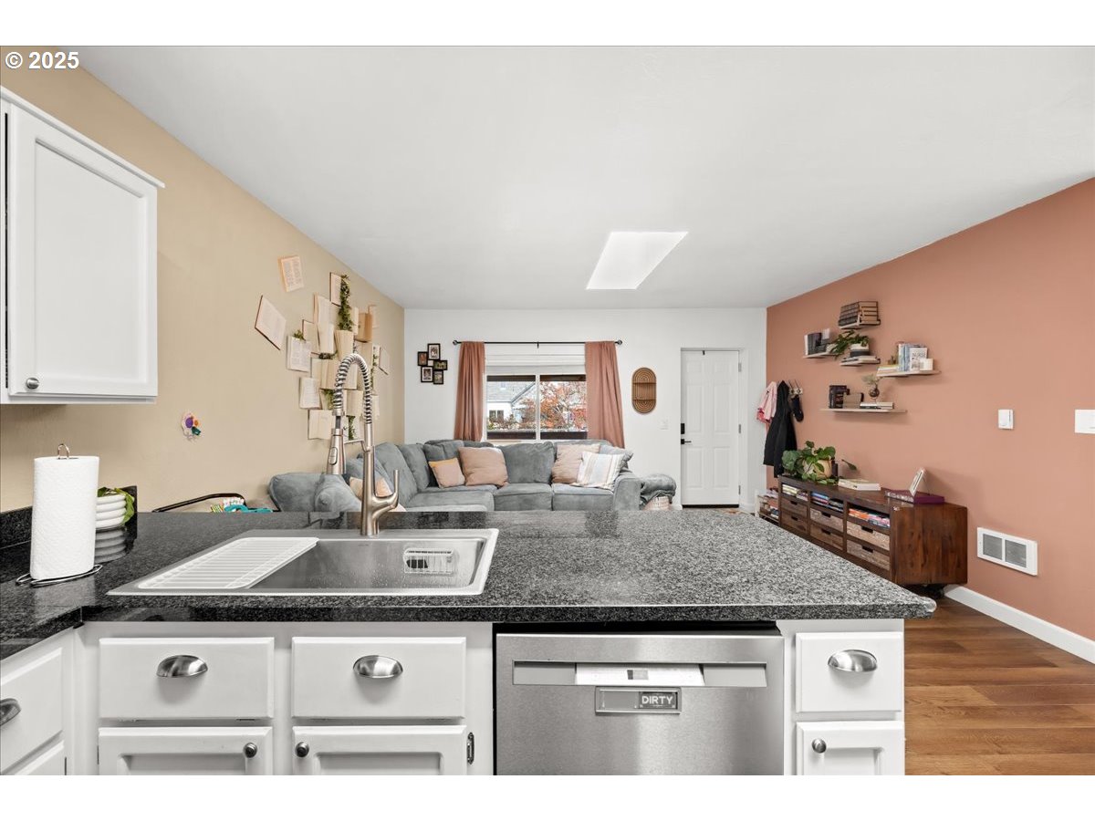 1720 B Street Forest Grove, OR 97116 - Photo 19 of 38 a kitchen with stainless steel appliances granite countertop a sink stove and cabinets