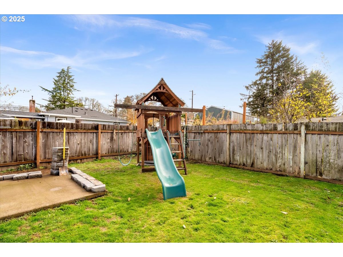 1720 B Street Forest Grove, OR 97116 - Photo 27 of 38 a view of a backyard with a slide