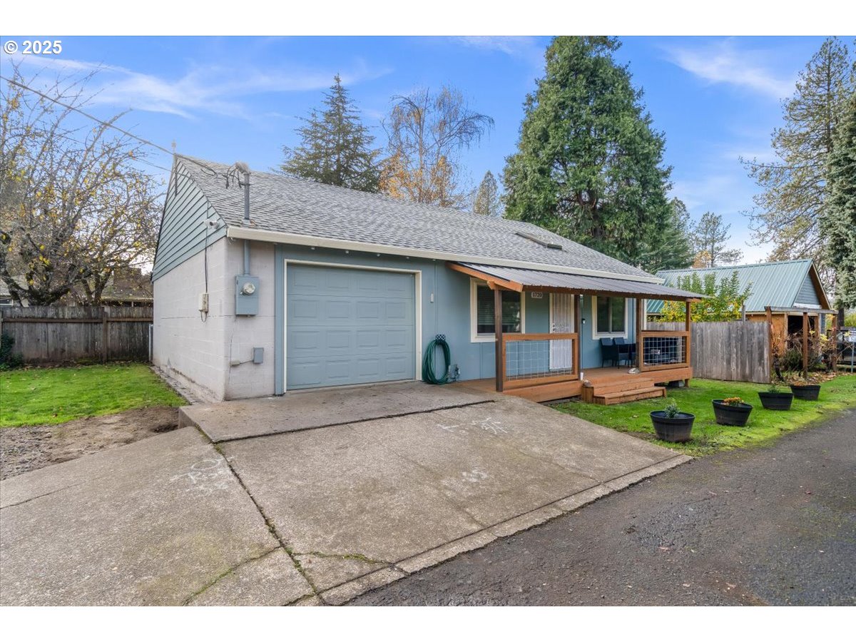 1720 B Street Forest Grove, OR 97116 - Photo 4 of 38 a view of a house with a yard and large tree